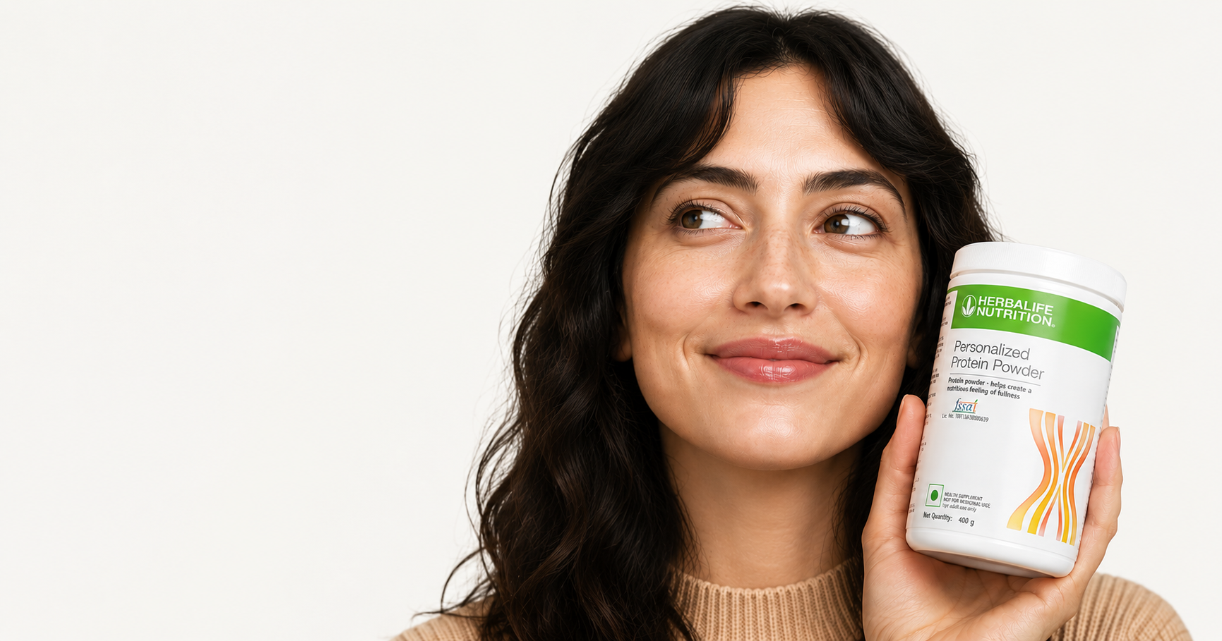 Woman holding Herbalife Protein Powder container